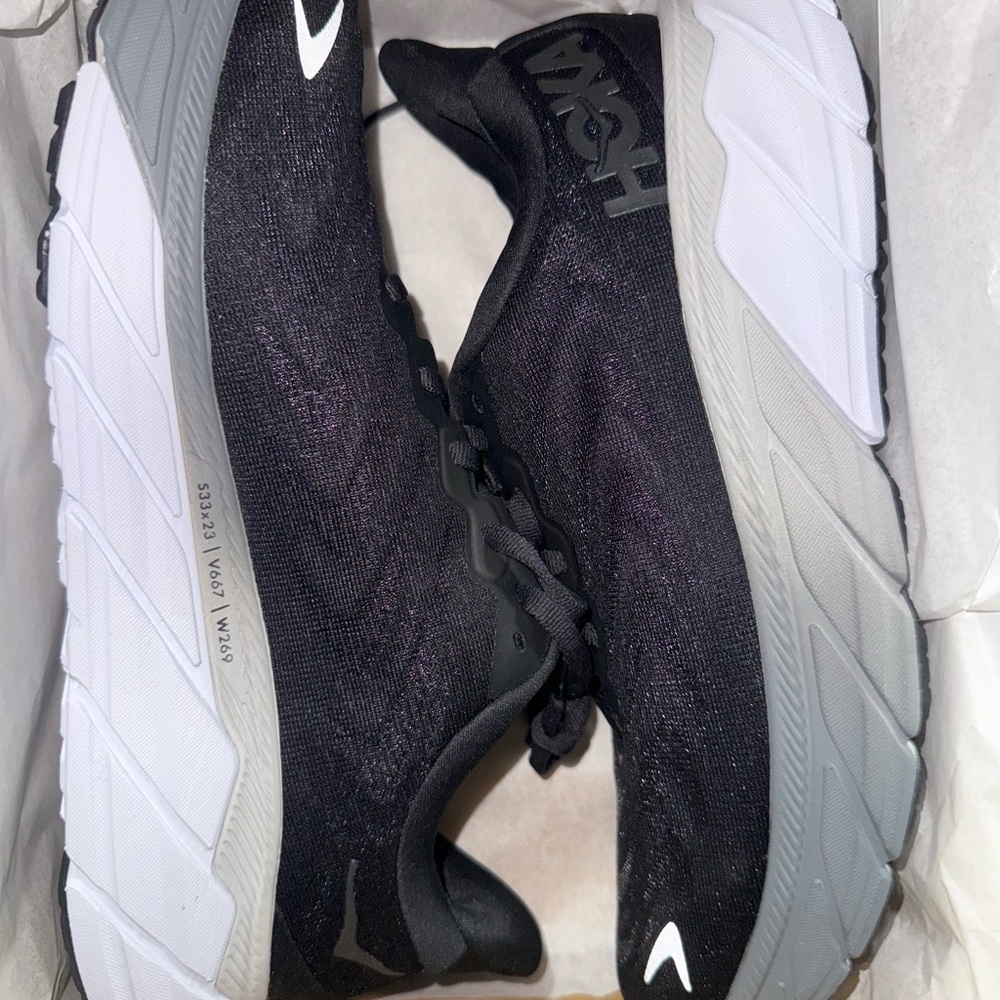 Hoka Black and White Athletic Shoes with Streamlined Design